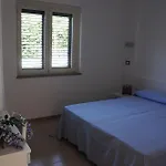 Деревянный коттедж Villaggio & Club Aquilia Бадолато-Стационе